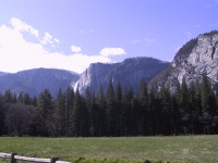 Rock_formations_with_Yosemite_falls_in_Distance.jpg