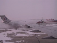 De_icing_the_plane_parked_next_to_us.jpg