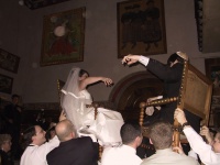 Carrying_the_Bride_and_Groom_in_Chairs.jpg
